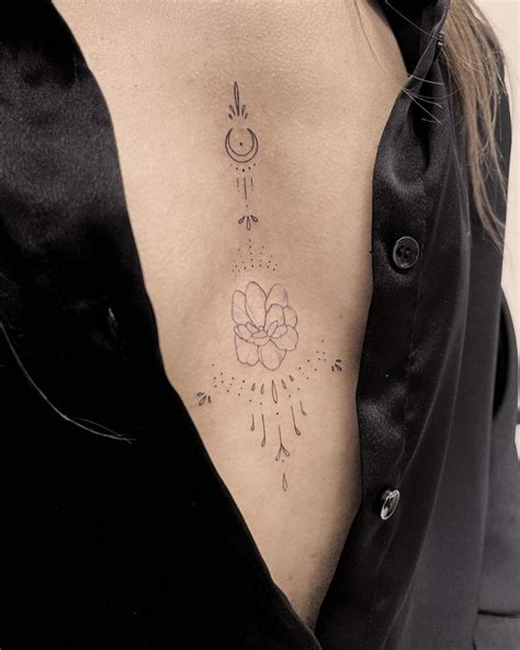 feminine underbreast tattoo|Under breast tattoo ideas